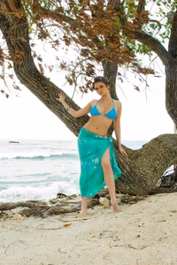 Sasha, one of the beautiful Penthouse Club Keygirls, unties her swimsuit and relaxes naked...