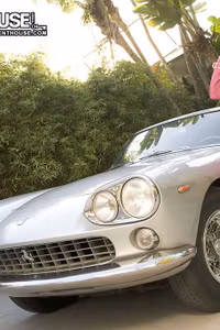 Charlie Laine flashes her naked body on and inside a vintage Ferrari roadster.